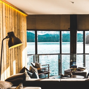 living room with a window view of a calming lake